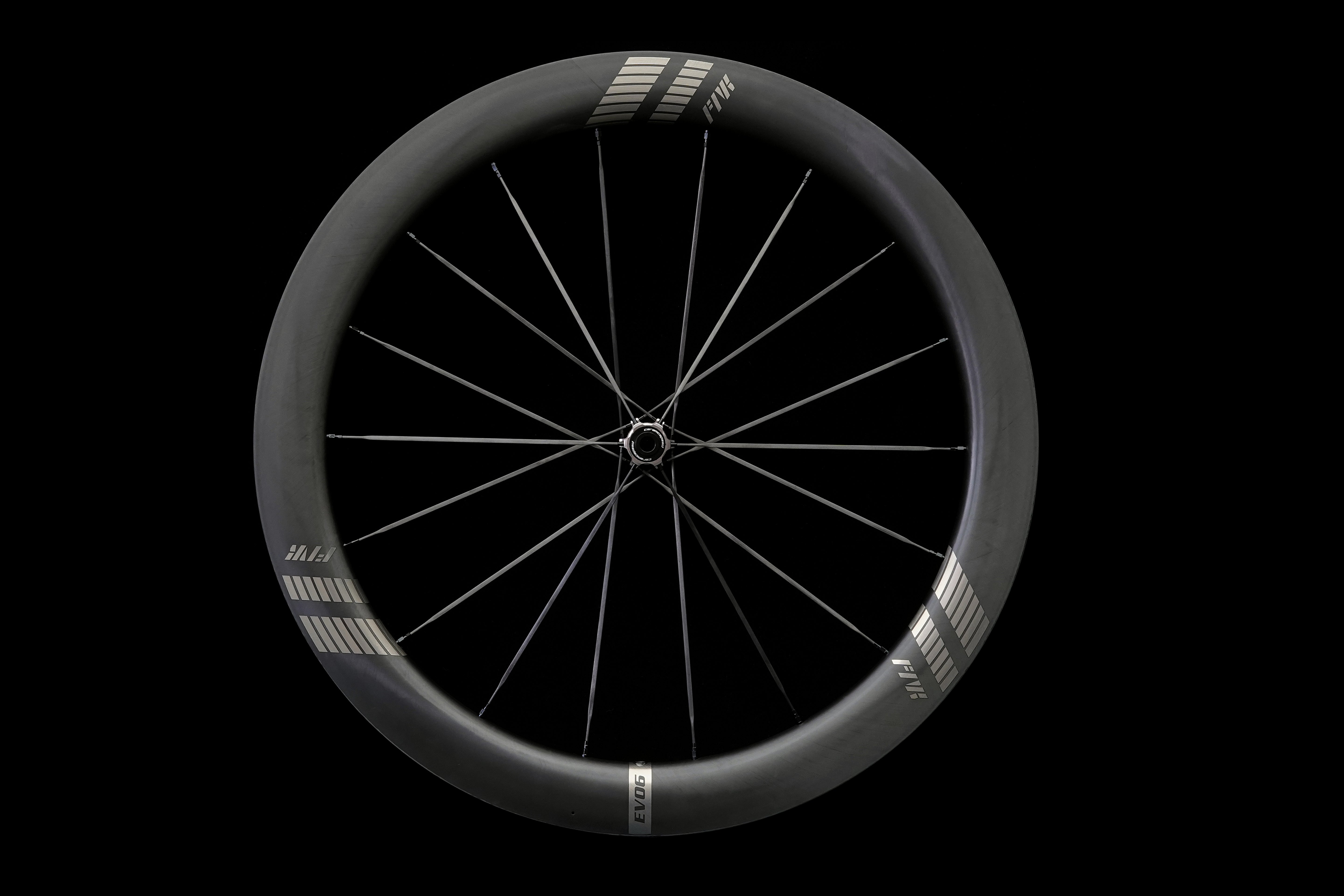 farports Black bicycle wheel on a black background