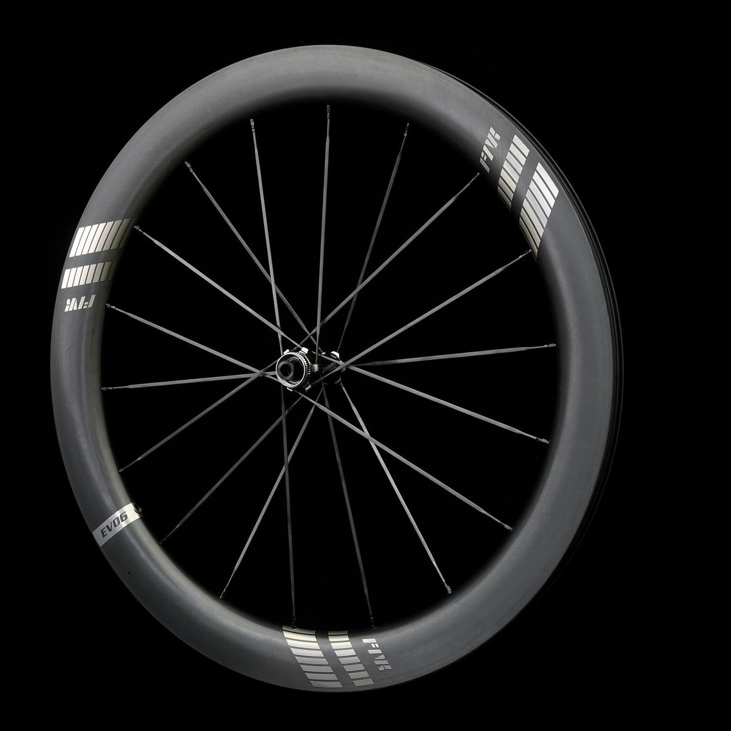 Bicycle wheel with black rim and carbon spokes on a black background