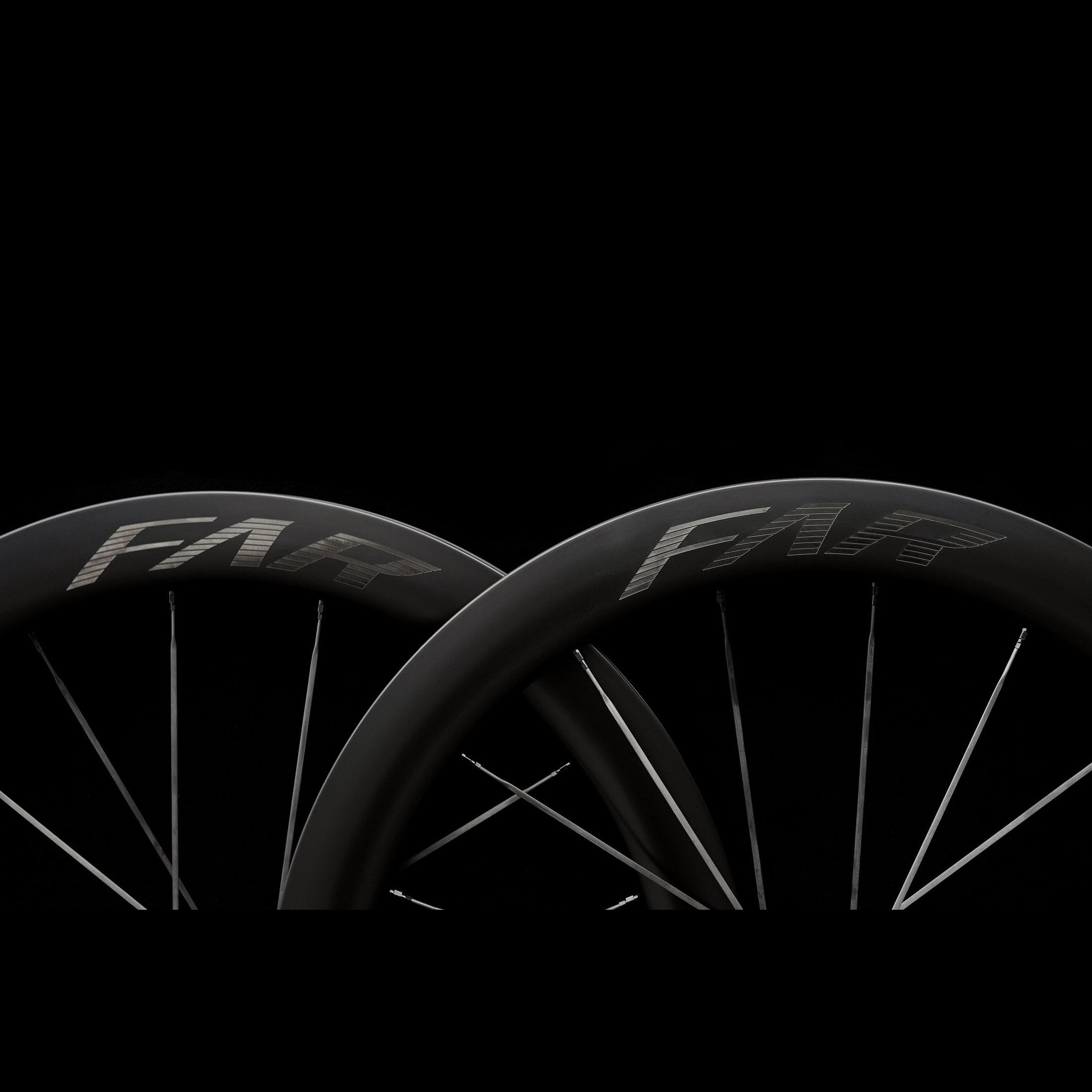 Two bicycle wheels with 'FARSPORT S6' branding on a black background